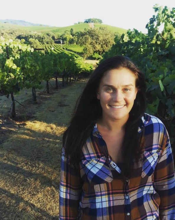 Elly Kirkhoff, founder of Front Range Food Forests, in a vineyard — a winemaker turned food forest designer